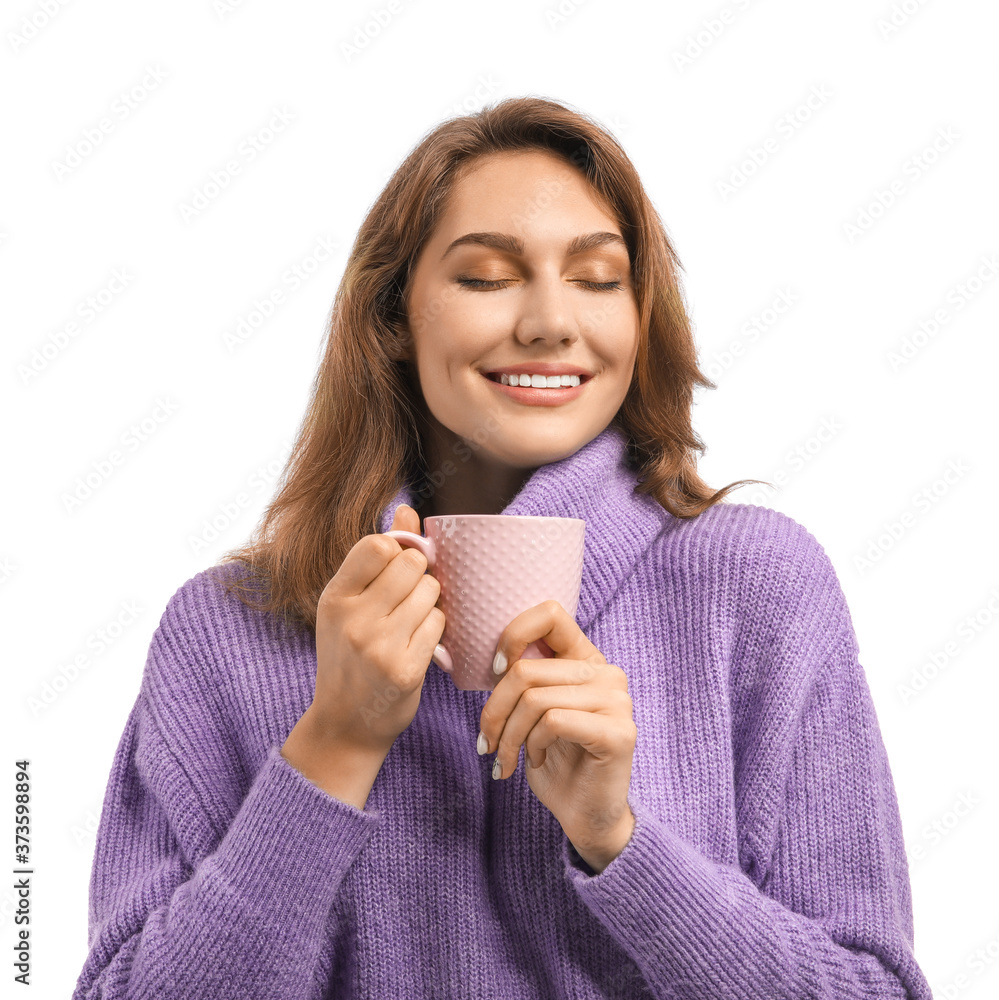 Beautiful young woman with cup of tea on white background