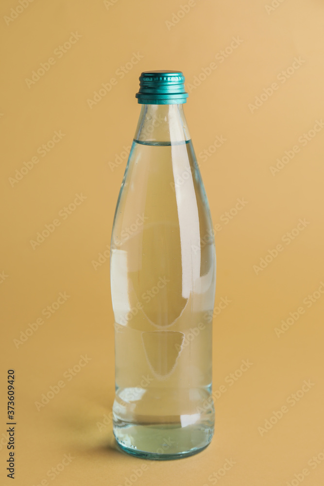 Bottle of clean water on color background