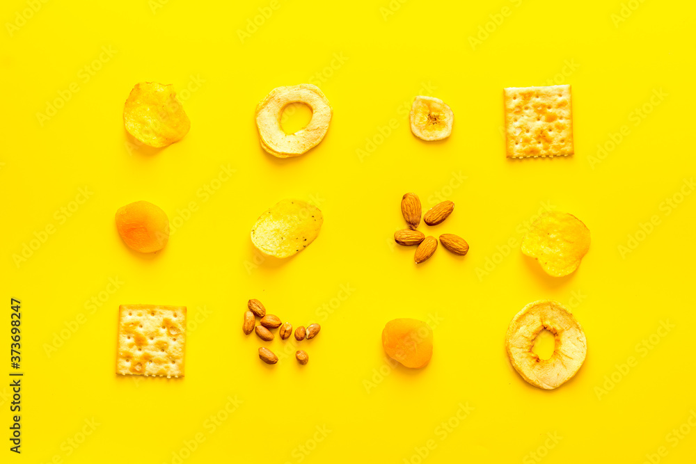 Pattern of snacks mix top view - nuts and dried fruits