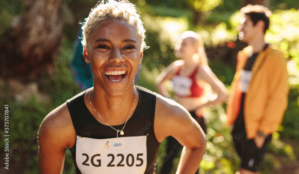 Cheerful cross country marathon runner