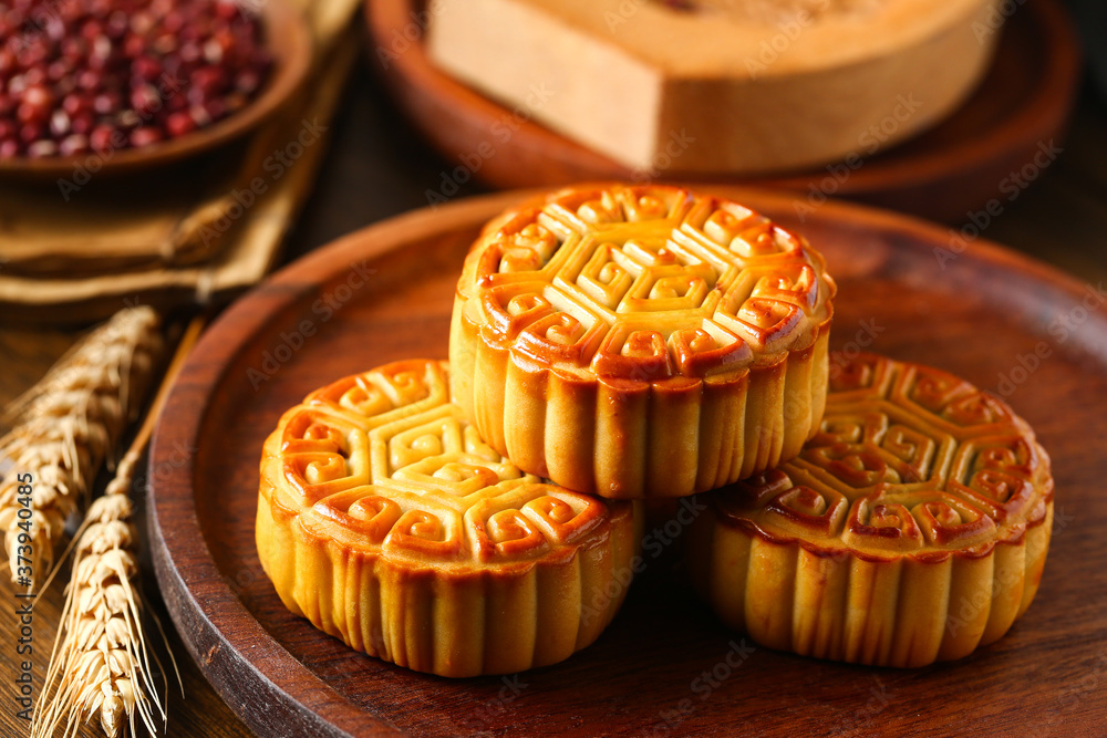 Chinese traditional mid autumn festival moon cake in wooden plate