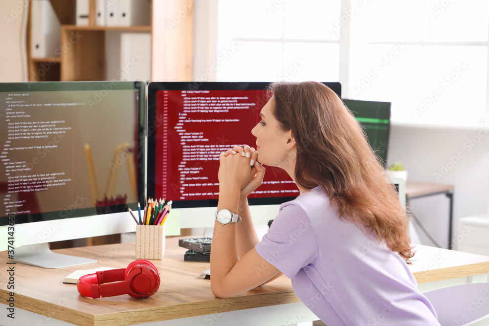 Female programmer working in office