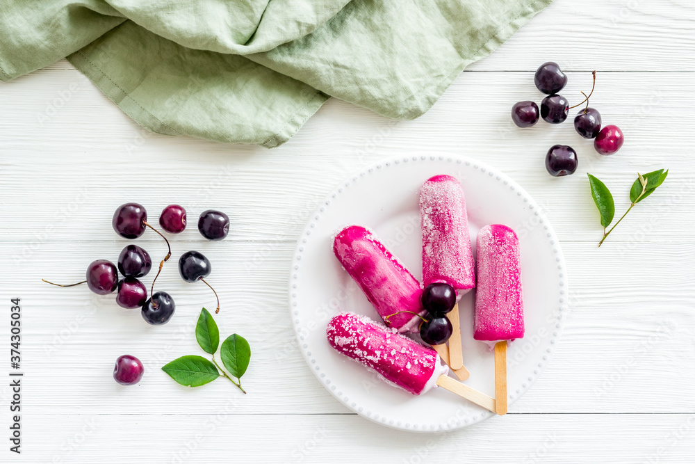 Cherry ice cream popsicles, top view, copy space