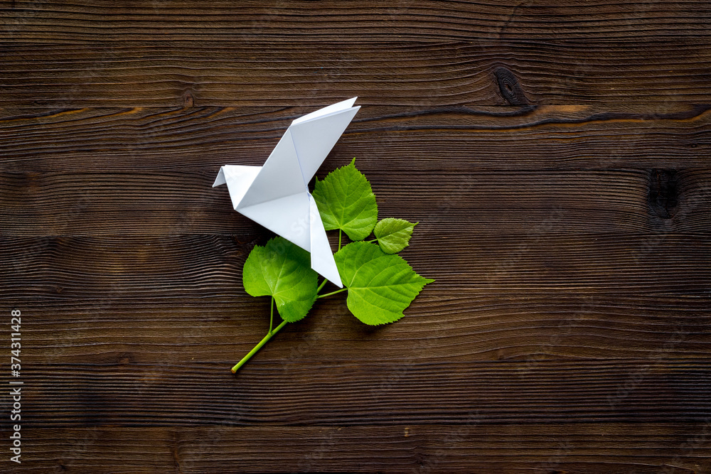 Origami pigeon. World Peace Day, care concept. Top view