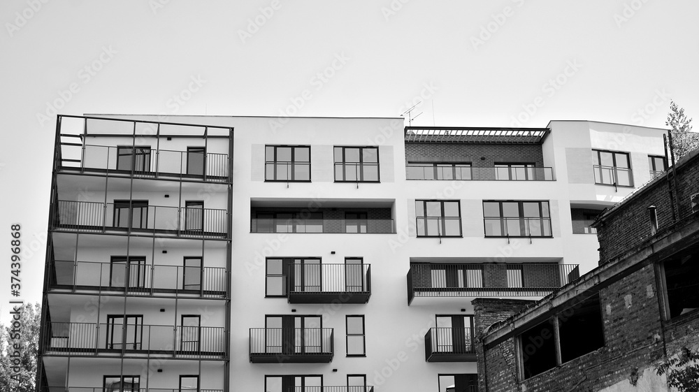 Detail of modern residential flat apartment building exterior. Fragment of new luxury house and home