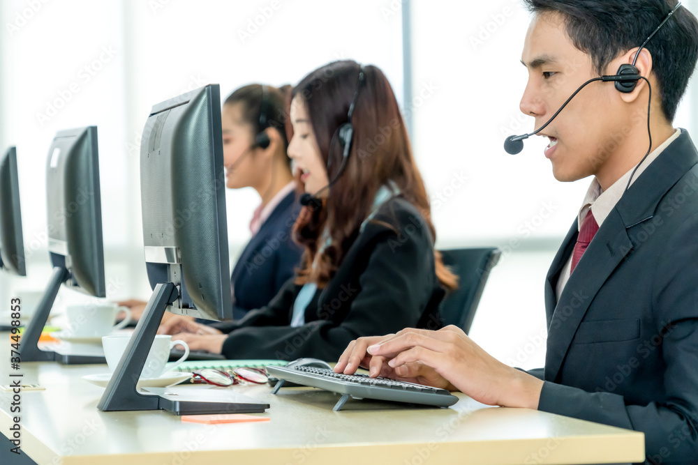 Business people wearing headset working in office to support remote customer or colleague. Call cent