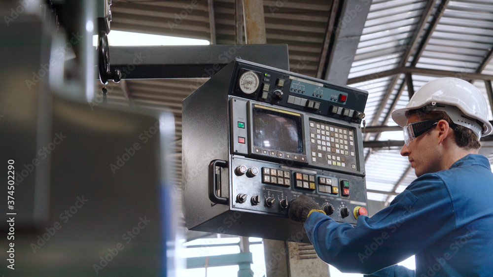 Smart factory worker using machine in factory workshop . Industry and engineering concept.