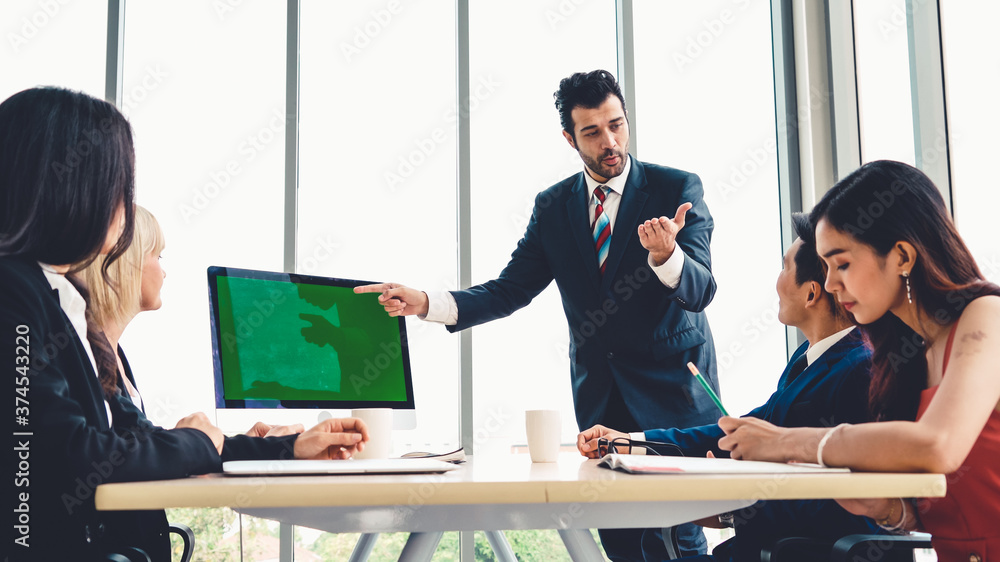 Business people in the conference room with green screen chroma key TV or computer on the office tab