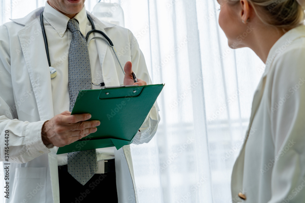 Doctor in professional uniform examining patient at hospital or medical clinic. Health care , medica