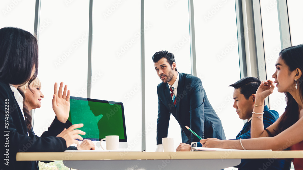 Business people in the conference room with green screen chroma key TV or computer on the office tab