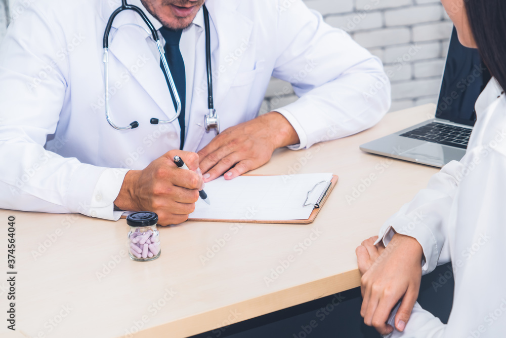 Doctor in professional uniform examining patient at hospital or medical clinic. Health care , medica