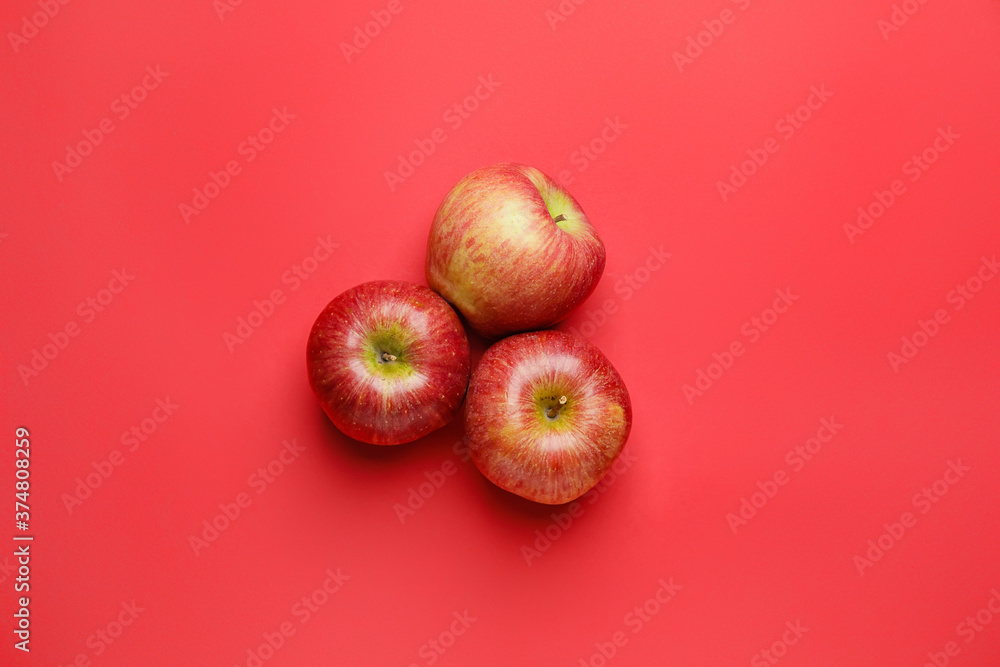 Fresh apples on color background