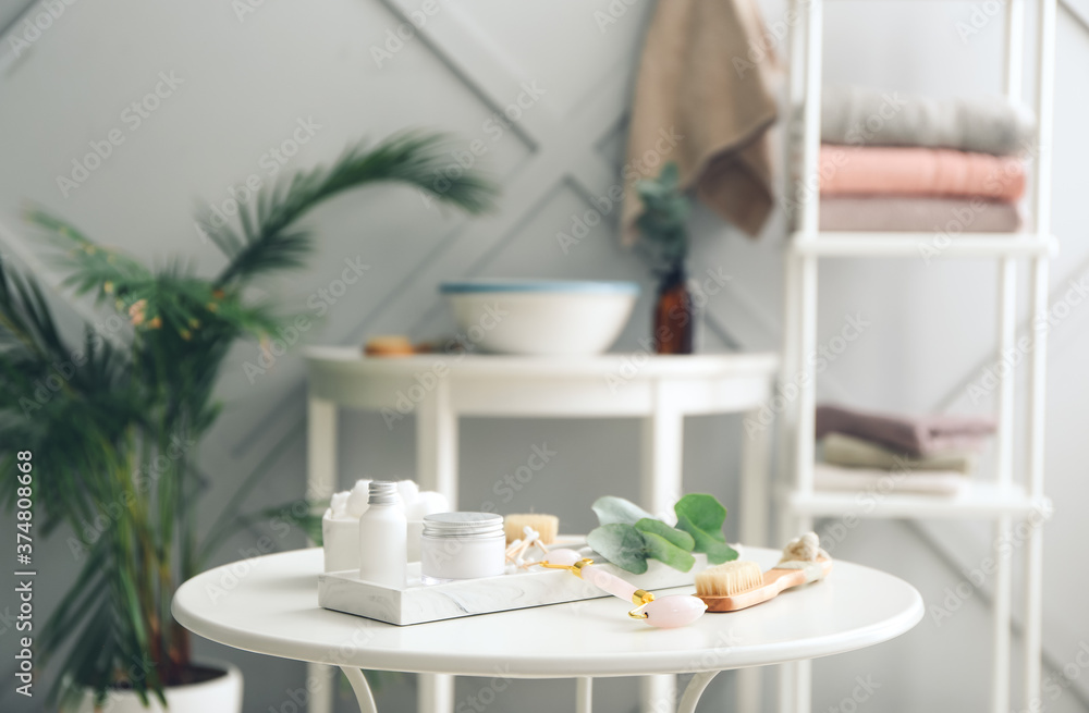 Natural bathing supplies and cosmetics on table in bathroom. Ecology concept