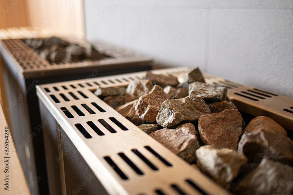 Big heater in Finnish sauna with hot stones