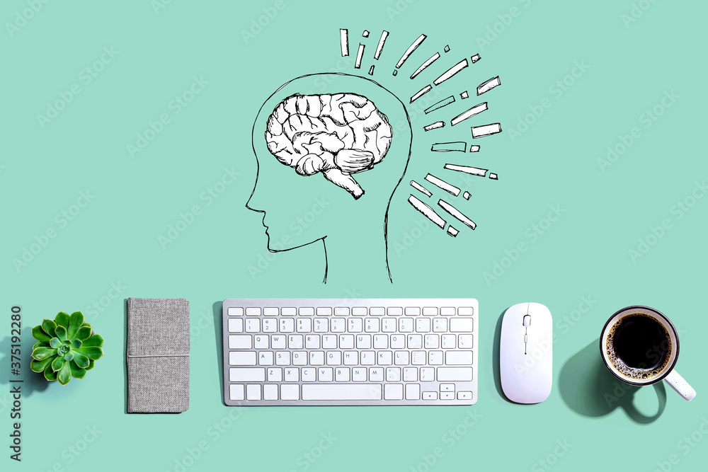 Brain illustration with a computer keyboard and a mouse