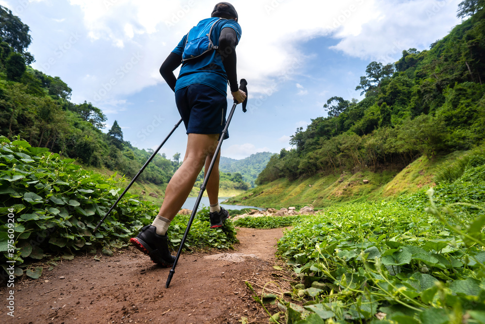 runner, hes running a trail. In the mountain nature trail