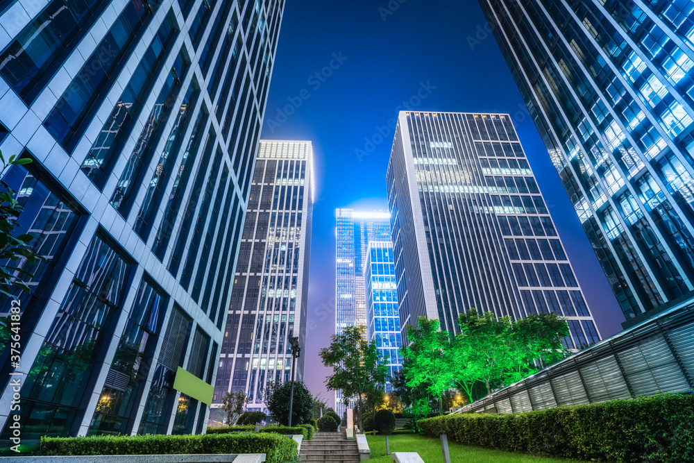 City square and modern high-rise buildings, night view of Jinan, China.