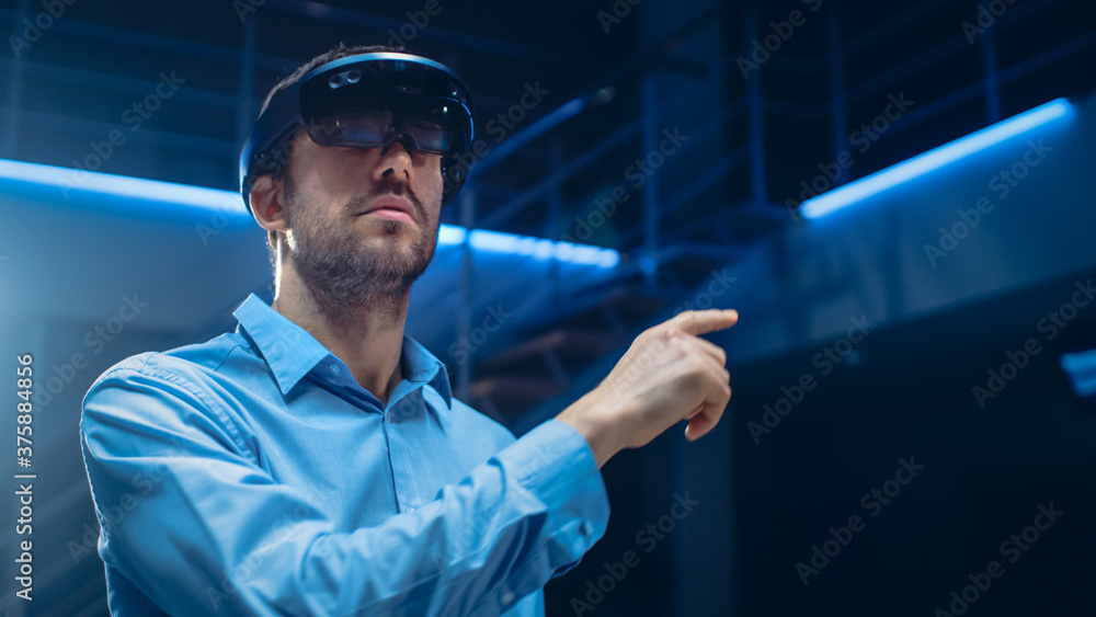 In 3D Content Creating Laboratory Engineer Wearing Professional Virtual Reality Headset Works and Ge