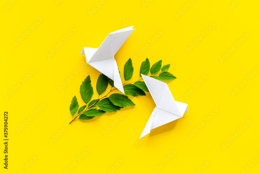 Origami pigeon. World Peace Day, care concept. Top view