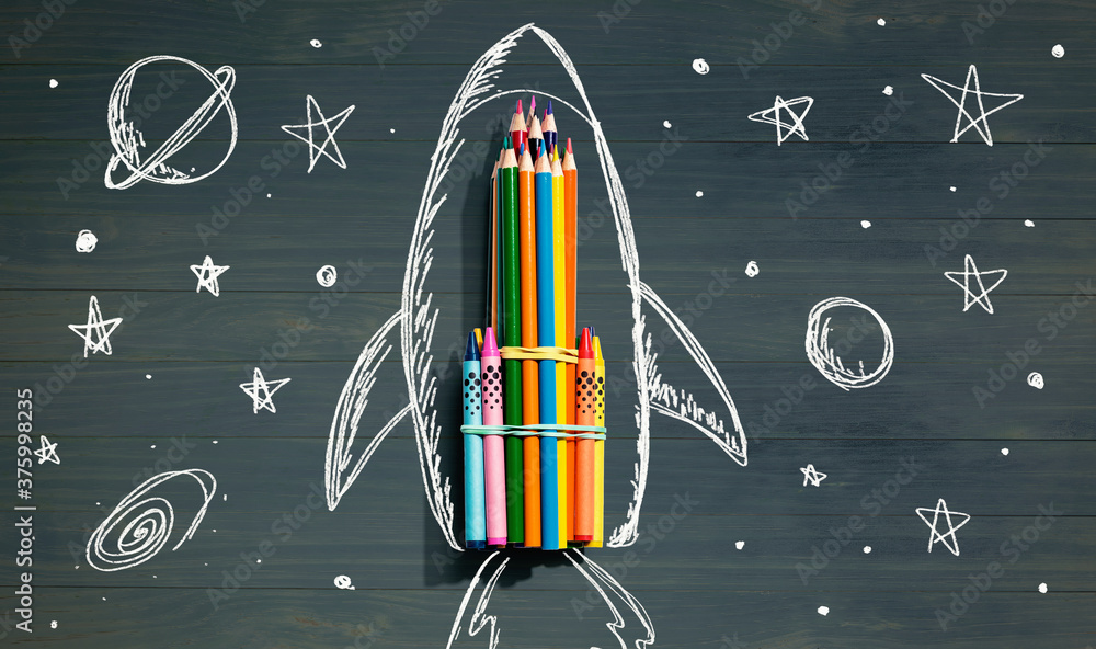 Back to school theme with hand drawn rocket and colored pencils