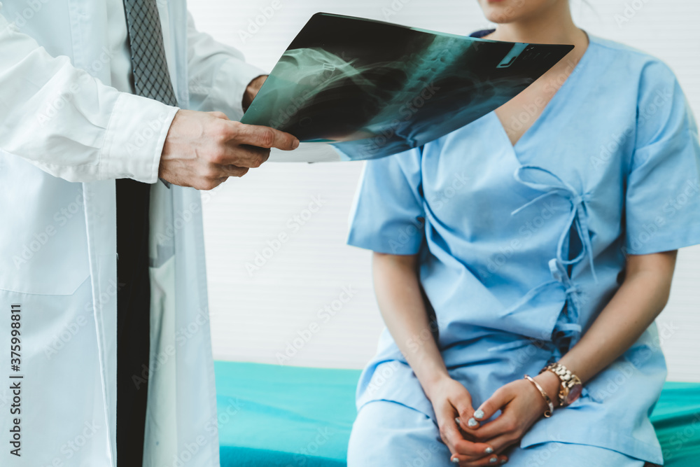 Doctor in professional uniform examining patient at hospital or medical clinic. Health care , medica