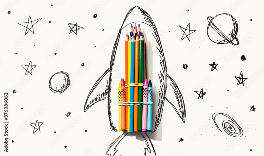 Back to school theme with hand drawn rocket and colored pencils