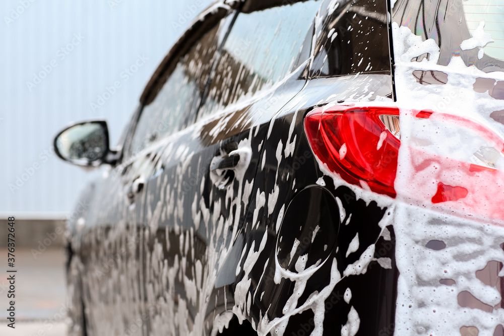 Modern automobile at car wash, closeup