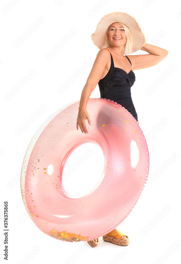 Mature woman with inflatable ring on white background