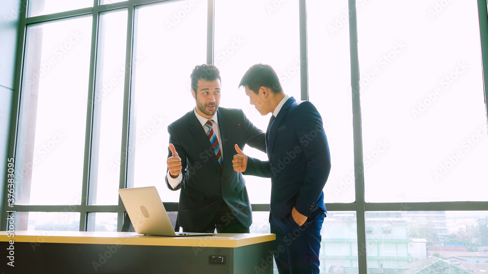 Two business people talk project strategy at office meeting room. Businessman discuss project planni