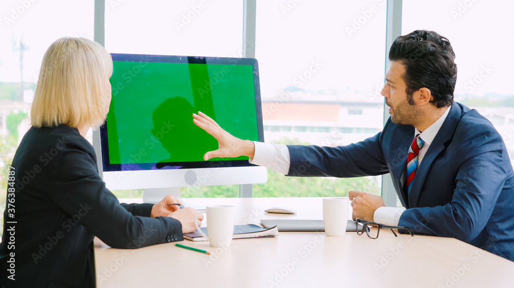 Business people in the conference room with green screen chroma key TV or computer on the office tab