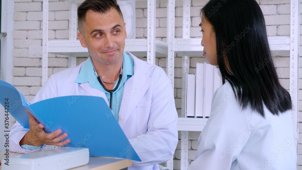 Doctor in professional uniform examining patient at hospital or medical clinic. Health care , medica