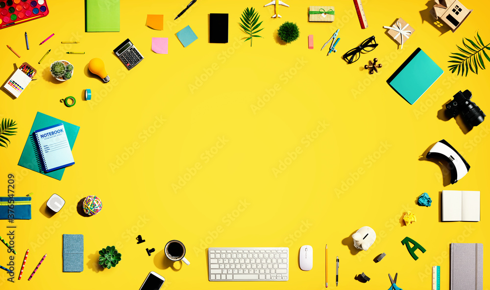 Collection of electronic gadgets and office supplies - flat lay