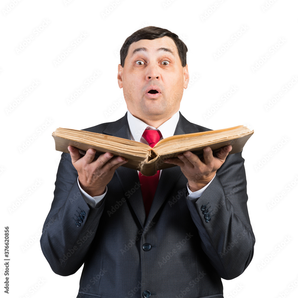 Surprised businessman holding open book