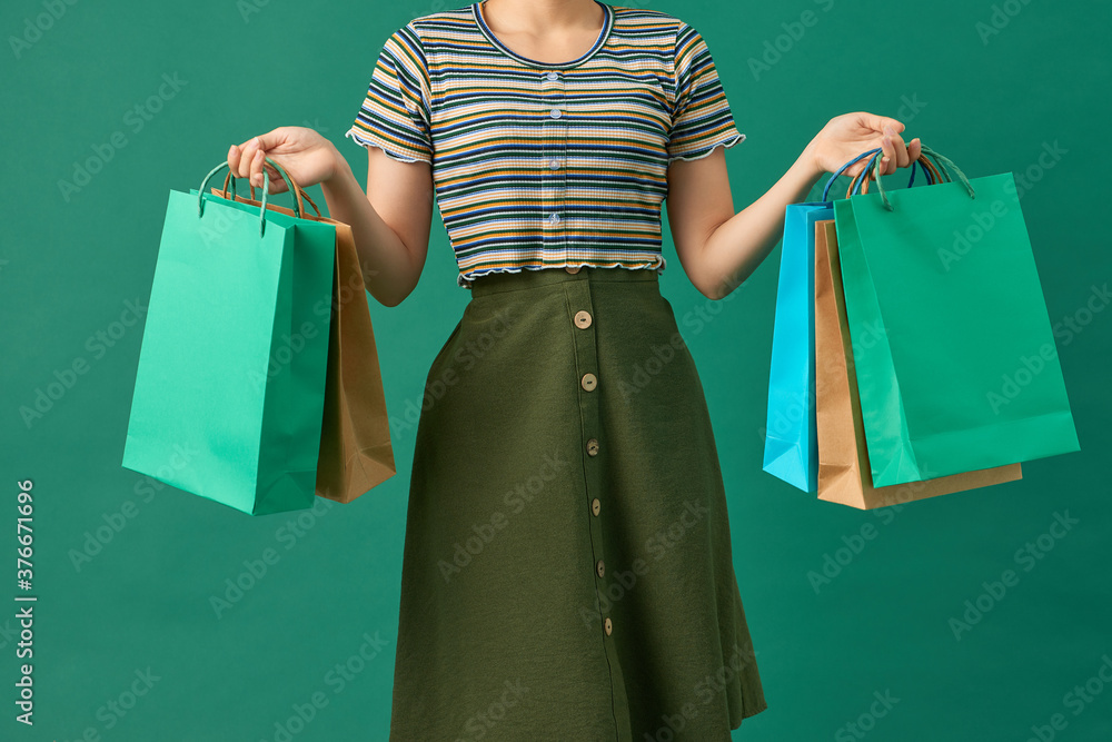 Pretty woman with shopping mall happiness packages