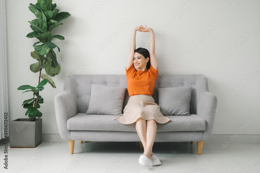 Lazy happy woman girl resting, enjoy peace of mind no stress on couch