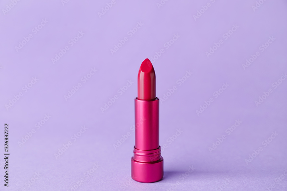 Beautiful lipstick on color background