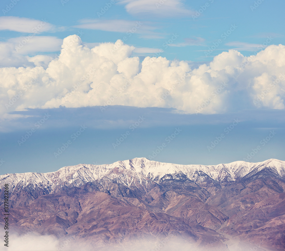 Snowy mountains with clouds