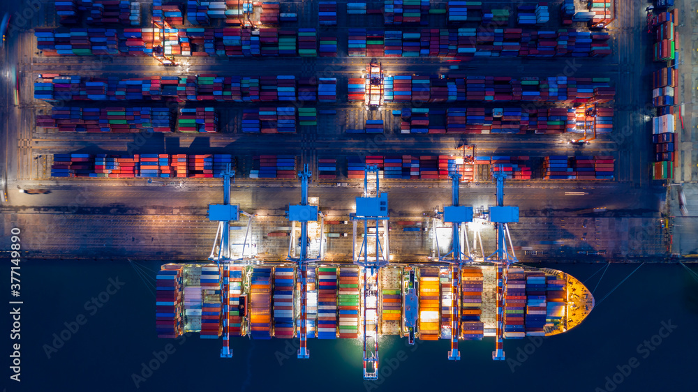 Aerial view container ship at night, import export commerce global business trade logistic and trans