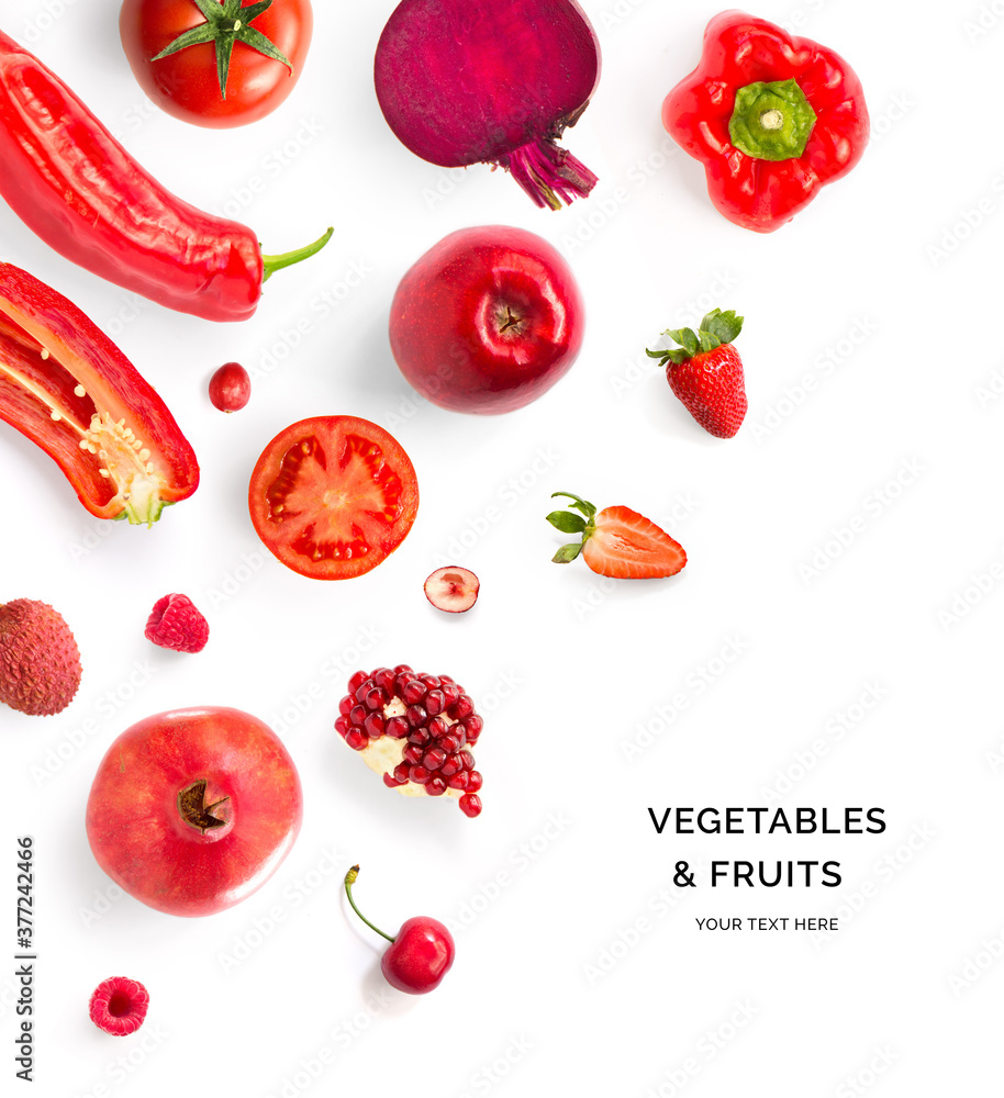 Creative layout made of red vegetables and fruits. Flat lay. Food concept. Tomato, red apple, pomegr