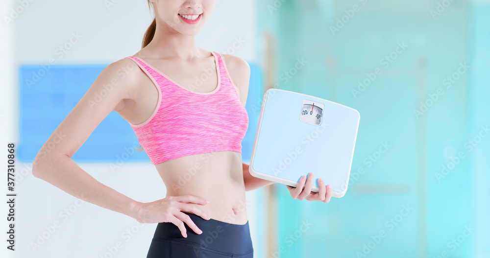 woman hold weight scale