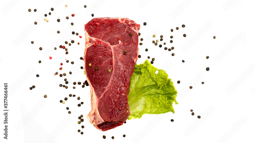 Steak striploin with salad and pepperon a white background. 