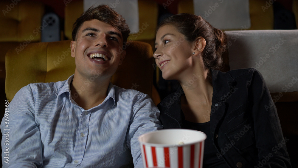 People audience watching movie in the movie theater cinema. Group recreation activity and entertainm