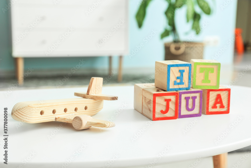 Childrens toys on table in room