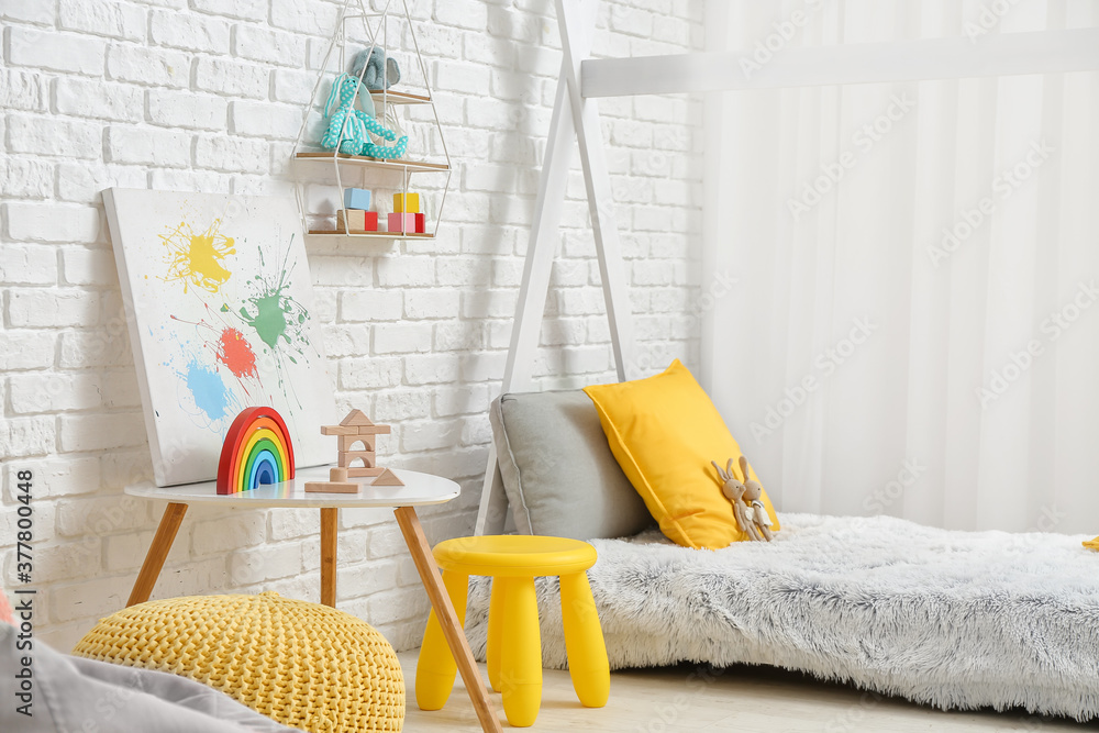 Interior of modern childrens room with comfortable bed