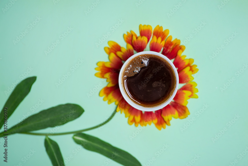 Cup of coffee on top of a flower