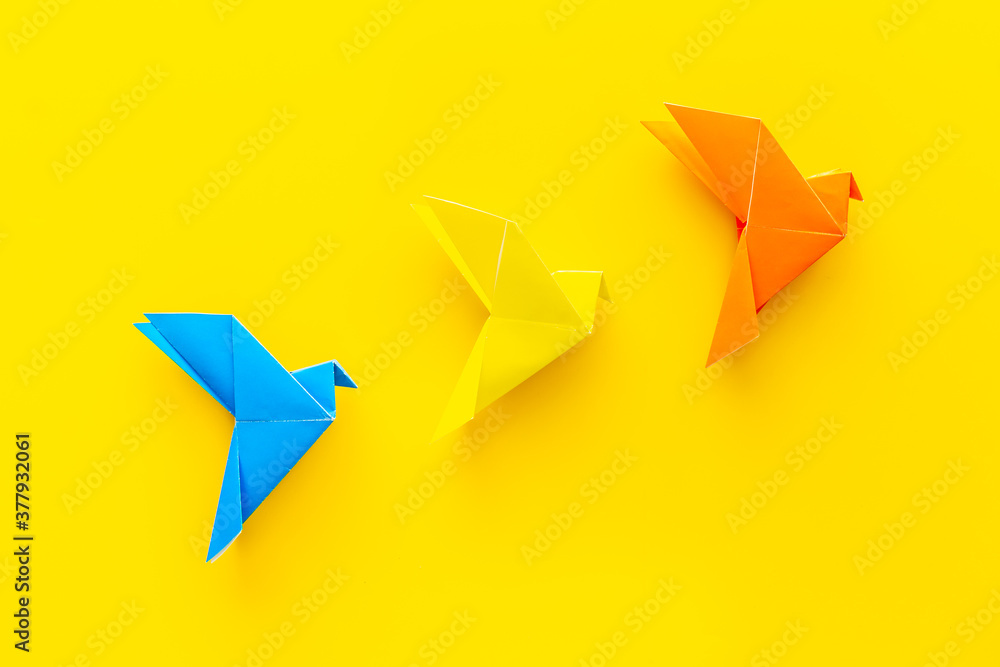 Paper birds of different shades. Origami concept. Top view