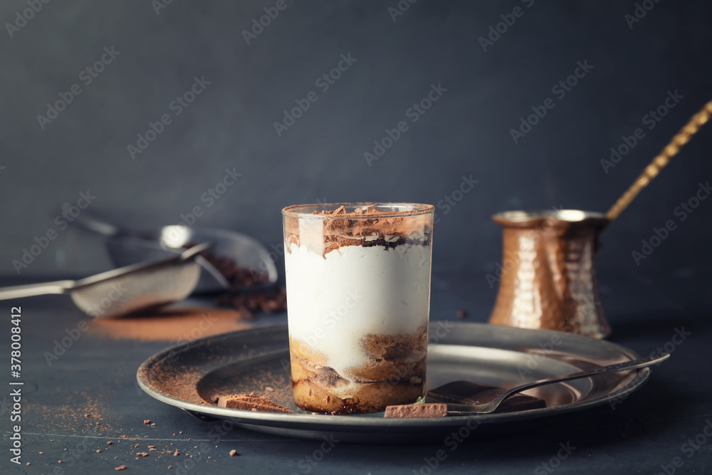 Tasty tiramisu on dark table