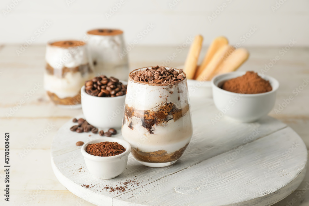 Sweet tasty tiramisu on table