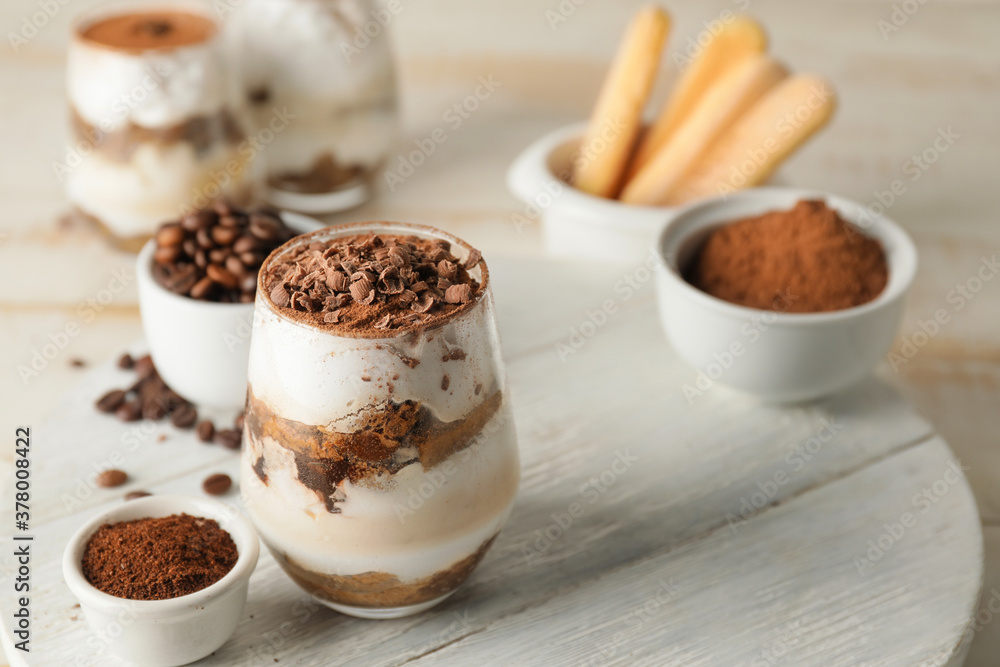 Sweet tasty tiramisu on table