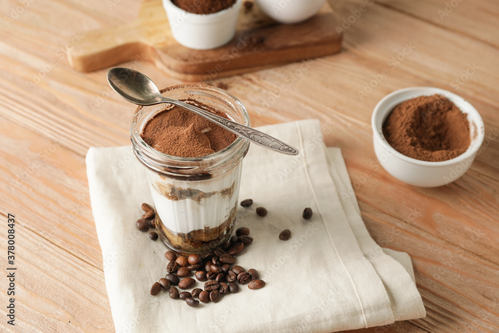 Sweet tasty tiramisu on table